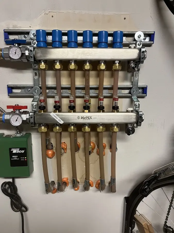 Plumber performing Water Heater Repair at a residential property in Dunbar